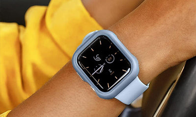 An apple watch on a wrist with a light blue protector case