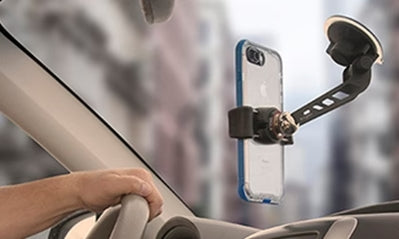 A phone mount suction to a car windshield